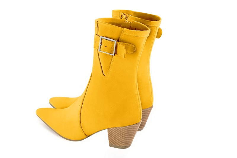 Yellow women's ankle boots with a zip on the inside. Tapered toe. Medium cone heels. Rear view - Florence KOOIJMAN